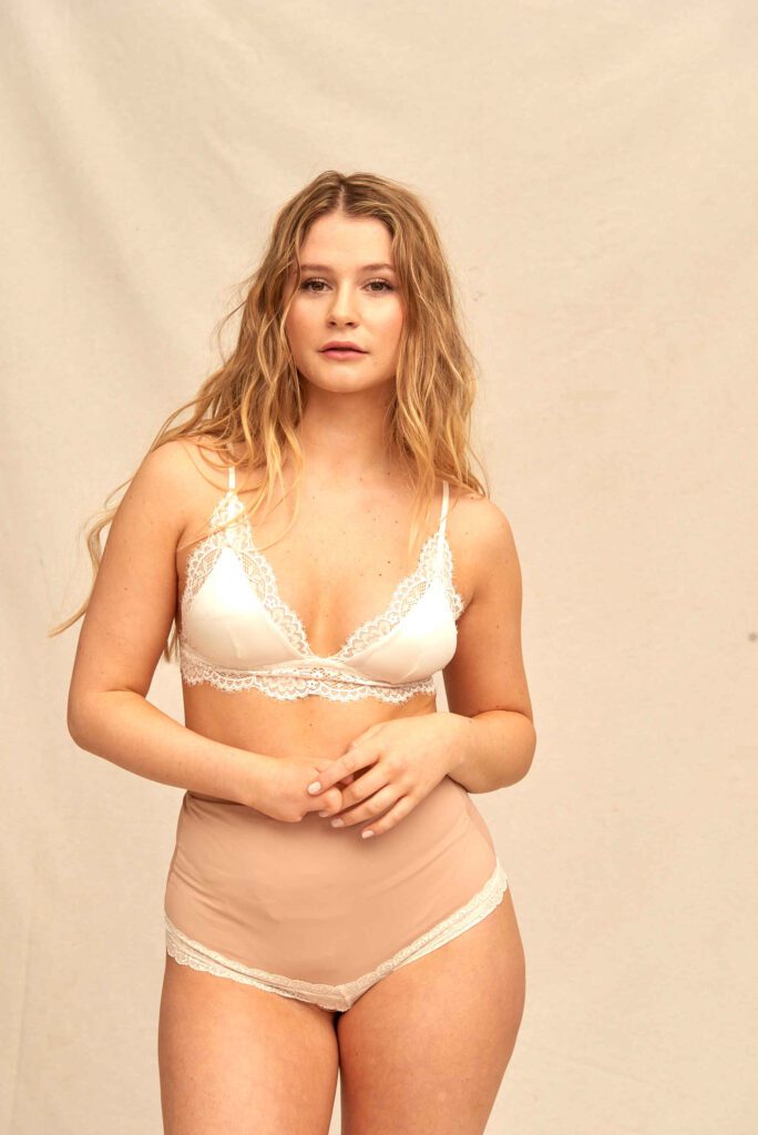 cream ostomy bag cover panties blonde woman in cream lace bra and beige high-waist ostomy panties as an ostomy bag cover