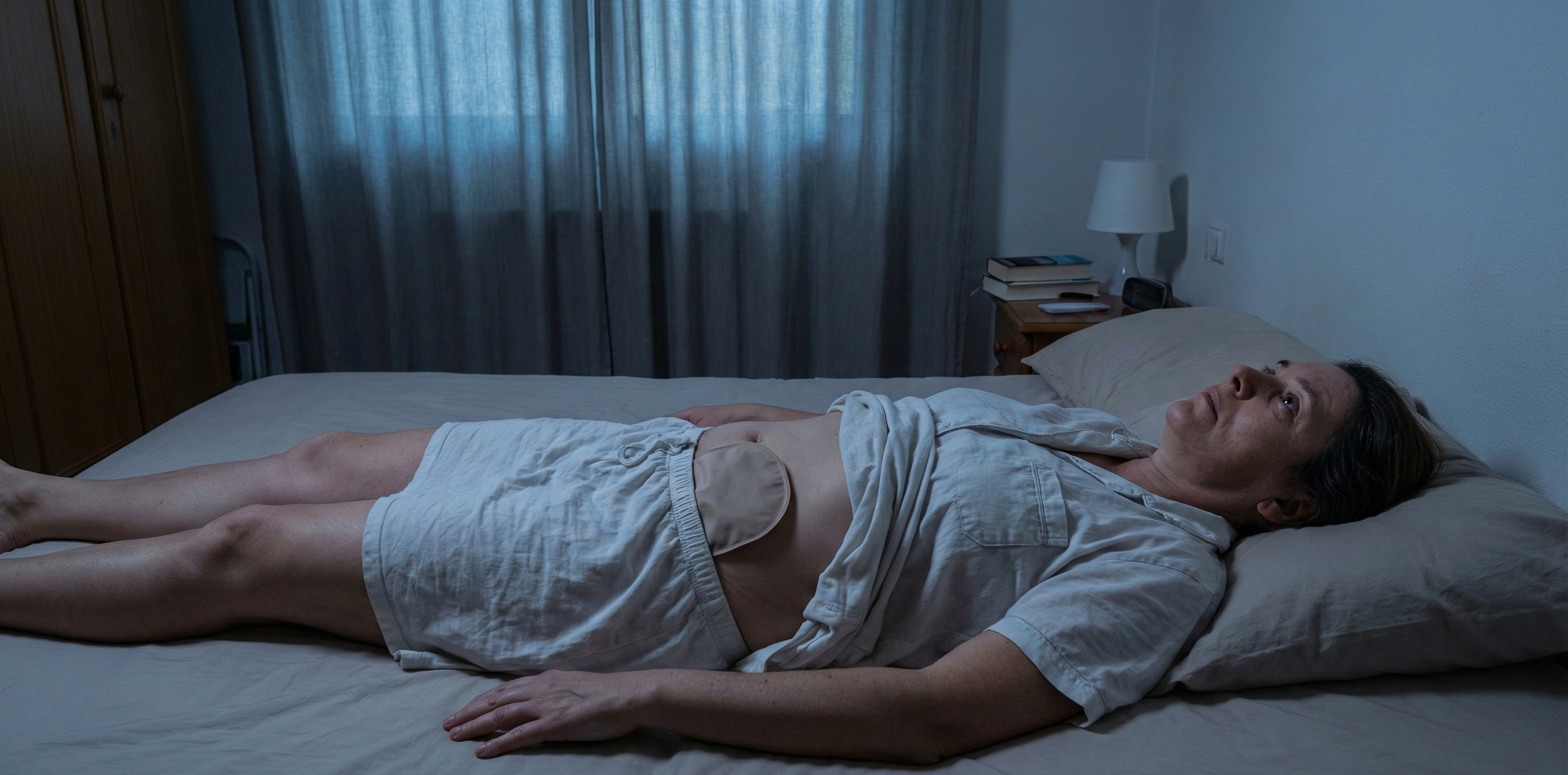 Ostomy bag resting on the abdomen during sleep