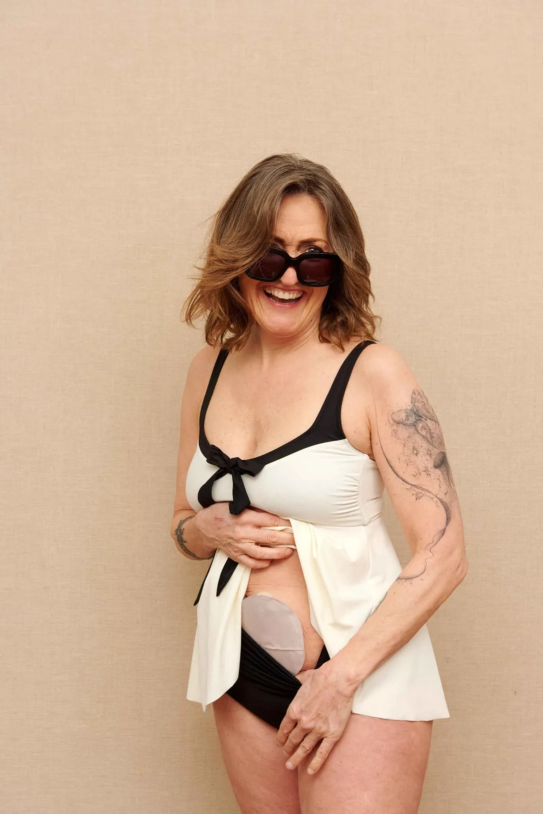 Stoma Swimwear BABY-DOLL Woman wearing the Baby Doll swim dress at a resort